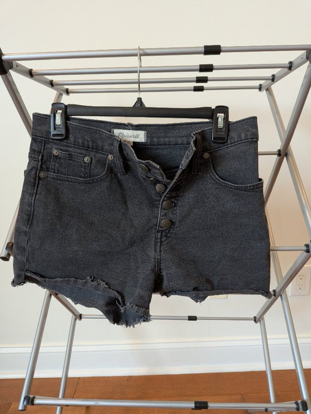 Faded black Madewell high-rise jean shorts, size 28, with button fly, 3" inseam